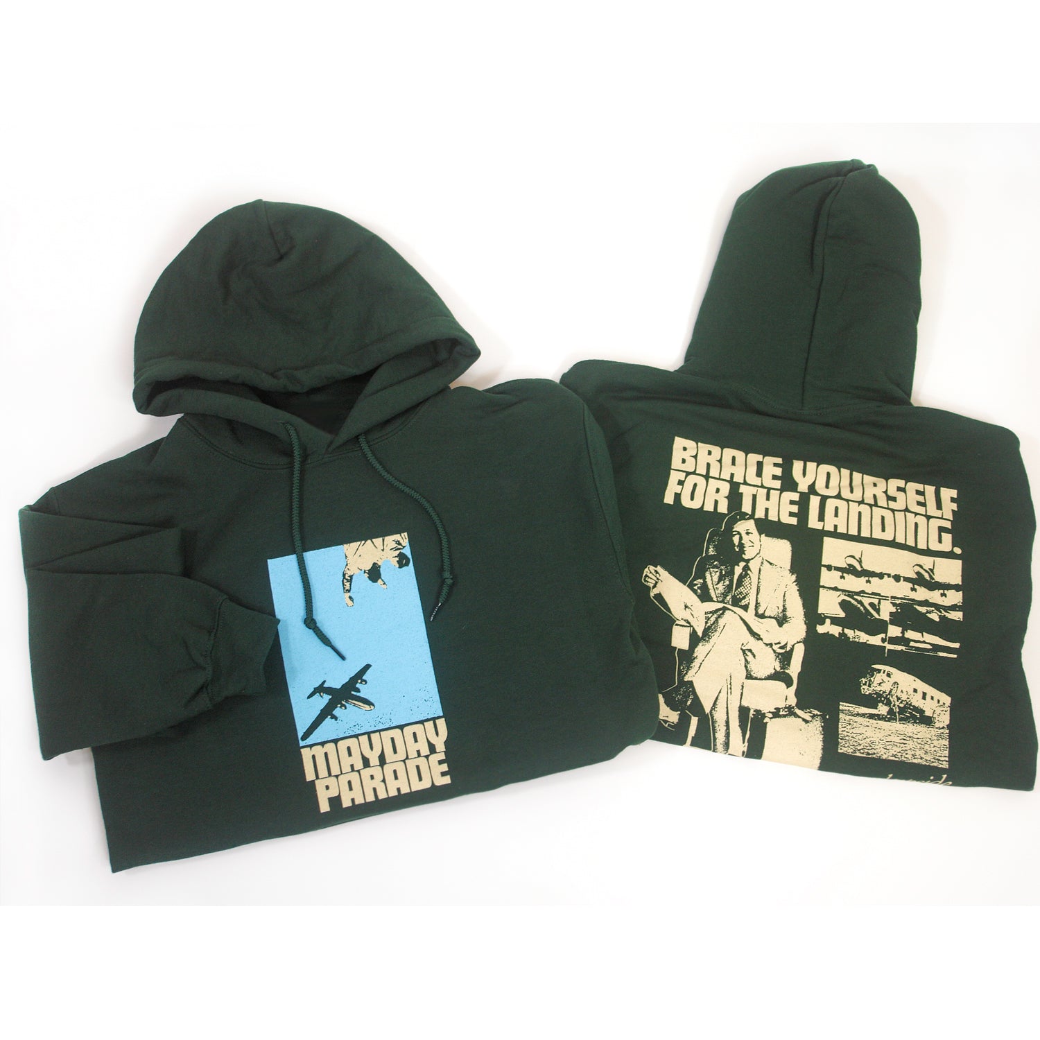 image of the front and back of a folded forest green pullover hoodie on a white background. front is on the left and has a center chest print of a blue rectangle with an airplane. below says mayday parade. the back is on the right and has an image of a man sitting with a suitcase and a collage of airplanes. across the shoulders says brace yourself for the landing. on the bottom right says Turned upside down? dial 1 800 m l s c r s h