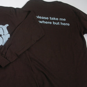 image of the back of a brown long sleeve tee. tee has a small center print that says please take me anywhere but here.
