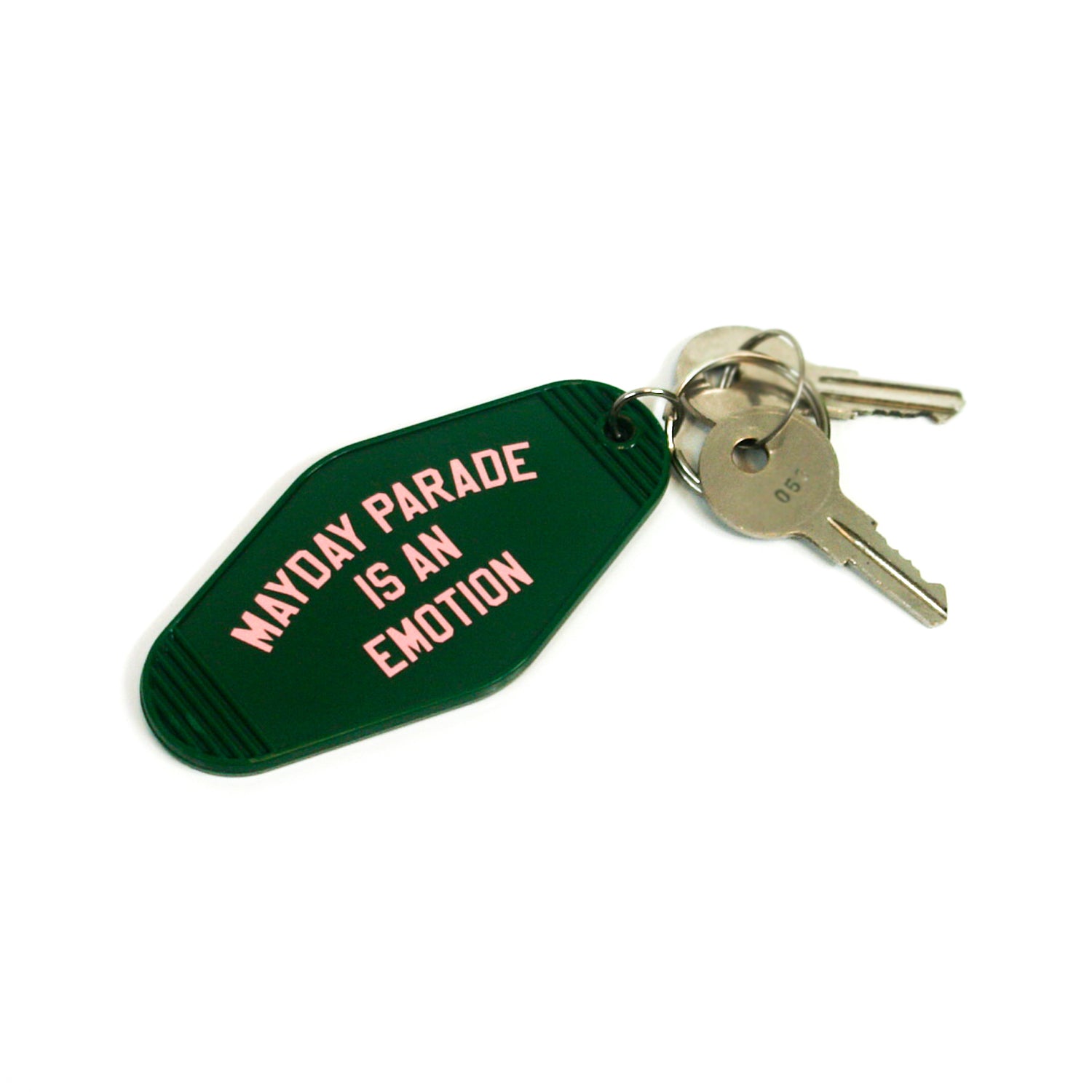 image of a forest green, plastic rhombus shaped key ring. in pink text on top of the keyring says mayday parade is an emotion