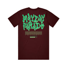 Load image into Gallery viewer, image of the back of a maroon tee shirt on a white background. tee says mayde parade in green slime like text. heartfelt message is printed below
