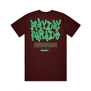 image of the back of a maroon tee shirt on a white background. tee says mayde parade in green slime like text. heartfelt message is printed below