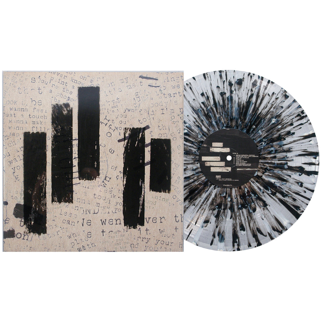 A Black Splatter Vinyl LP from Mayday Parade sits beside its album cover, which features scattered, faded text and four bold vertical black paint strokes on a textured grayish background.