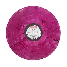 Load image into Gallery viewer, A marbled pink and Sad Purple Smoke vinyl record by Mayday Parade, with the band’s name at the top center label and song titles, including "Sad," listed on the left and right of the label.
