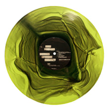 Load image into Gallery viewer, A translucent green vinyl record by Mayday Parade with swirling dark green patterns like a ripple highlighter effect, and a black center label displaying white text and logos.
