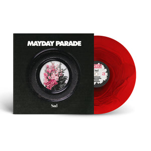 A limited edition red vinyl, the Red Ripple Variant by Mayday Parade, is partially shown in its black album cover with Sad beneath and a circular frame of pink and white flowers.