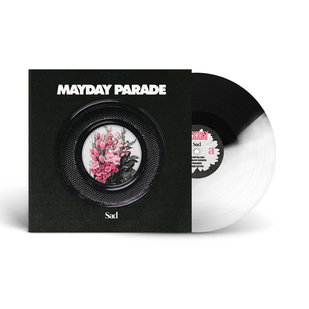A black and white Mayday Parade vinyl (Black And Clear Blend Variant) is partly out of its sleeve. The cover displays MAYDAY PARADE above a round window with pink flowers in a vase and Sad at the bottom.