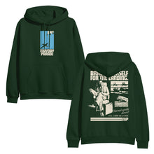 Load image into Gallery viewer, image of the front and back of a forest green pullover hoodie on a white background. front is on the left and has a center chest print of a blue rectangle with an airplane. below says mayday parade. the back is on the right and has an image of a man sitting with a suitcase and a collage of airplanes. across the shoulders says brace yourself for the landing. on the bottom right says Turned upside down? dial 1 800 m l s c r s h
