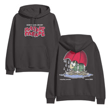 Load image into Gallery viewer, image of the front and back of a railroad grey pullover hoodie. front is on the left and has a center chest print that says don&#39;t rain on my mayday parade. back is on the right and has a full print of someone with a large red umbrella standing in a rain puddle
