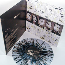 Load image into Gallery viewer, A Mayday Parade Black Splatter Vinyl LP is shown in front of its open album cover, which features collage-style art with faces, text, and torn paper. Lyrics and credits are visible inside.
