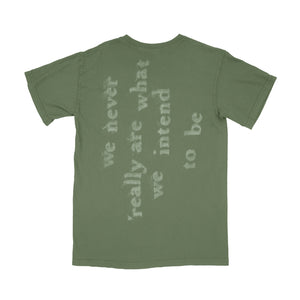 Mayday Parade olive green Comfort Colors t-shirt with we never really are what we intend to be in faded white text printed diagonally across the back, shown laid flat on a white background.