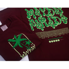 Load image into Gallery viewer, image of the front and back of a maroon tee shirt on a white background. front is on the left and has a green palm tree and says mayday parade. back is on the right and says mayde parade in green slime like text. heartfelt message is printed below
