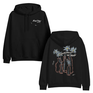Mayday Parade pullover hoodie by Gildan Heavy Blend in black with “MAYDAY PARADE” on the front left chest and a line drawing of flowers in vases with handwritten text “NOTHING LIVES OR STAYS” on the back.