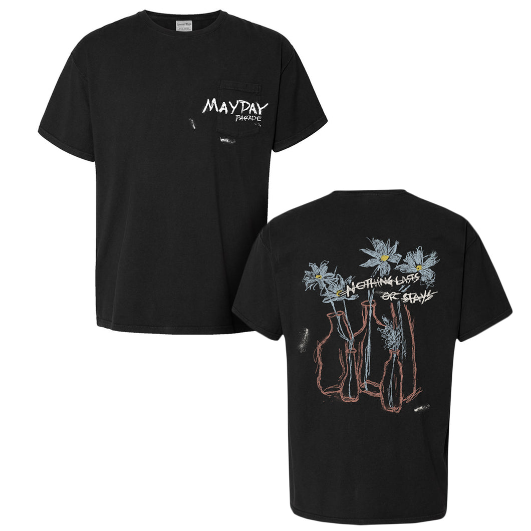 The Mayday Parade ComfortWash Black Pocket T-Shirt features a small band logo and chest pocket on the front. The back showcases hand-drawn vases with daisies and 