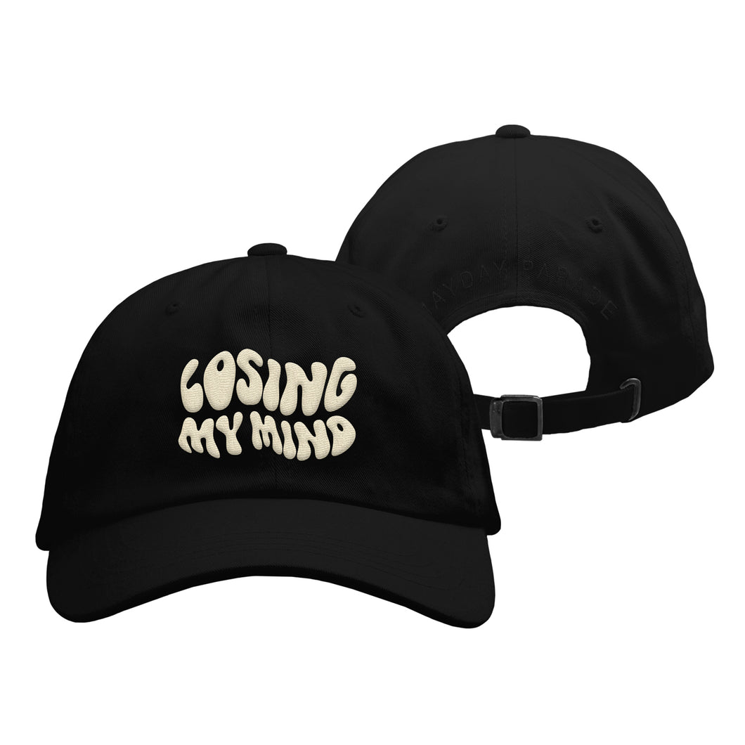 image of the front and back of a black dad hat on a white background. front of the hat is on the left and has cream embroiderd text that says losing my mind. the back of the dad hat is on the right and has black arched embroidery that says mayday parade