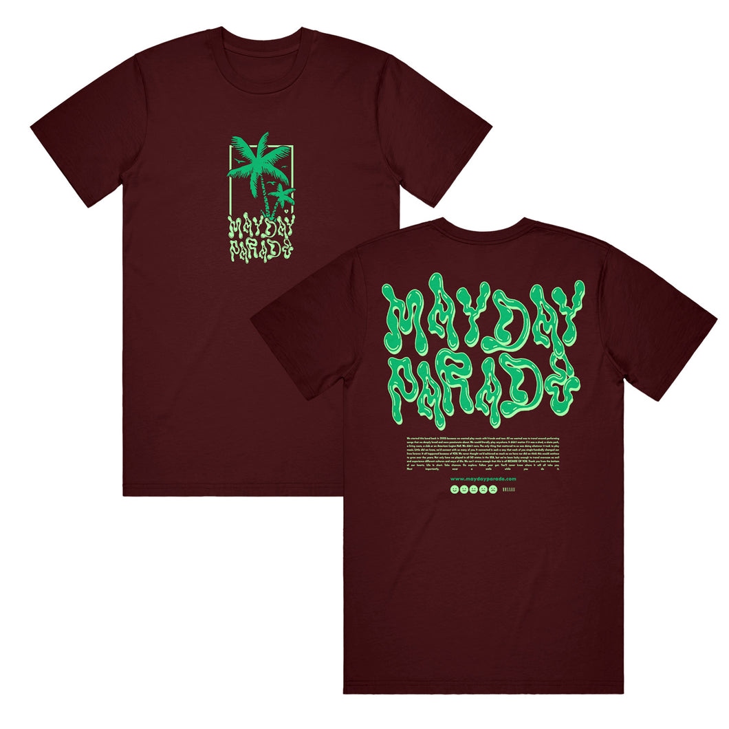 image of the front and back of a maroon tee shirt on a white background. front is on the left and has a green palm tree and says mayday parade. back is on the right and says mayde parade in green slime like text. heartfelt message is printed below