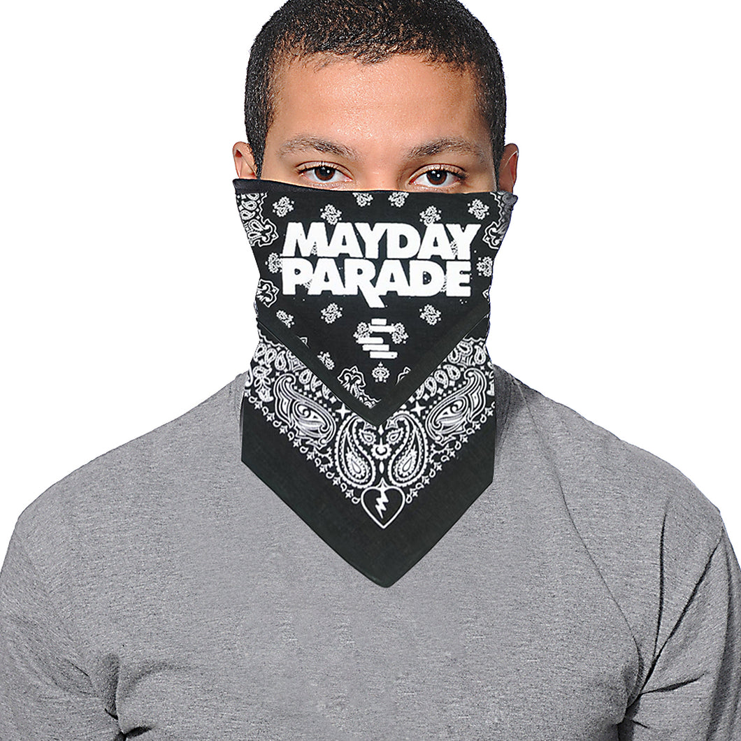 image of a man with short dark hair and a grey tee shirt wearing a black bandana wrapped around his face on a white background. the bandana is black with white print of paisley patterns and mayday parade in the center
