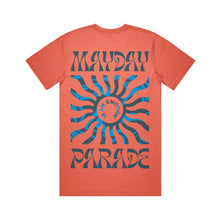 Load image into Gallery viewer, image of the back of a salmon colored tee shirt on a white background. tee has a full body print. at the top says mayday and the bottom says parade. in the center is a blue sun shape and inside says is an emotion.
