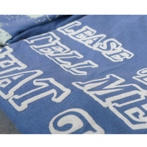 close up shot of the puff printing on the back of a blue tee shirt.