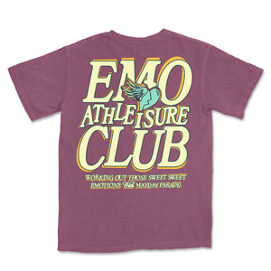 image of the back of a berry colored tee shirt on a white background. the back of the tee has a full back print in cream with orange outline that says emo athleisure club. across the bottom says working out those sweet sweet emotions with mayday parade