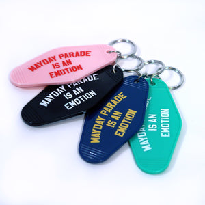 image of a stack of keyrings in various colors on a white background. the key rings say mayday parade is an emotion