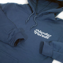 Load image into Gallery viewer, close up, angled image of the front of an indigo colored pullover hoodie on a white background. the hoodie has a small right chest print that says mayday parade.
