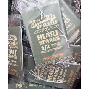 image of a bunch of teal rectangle shaped air freshener. air freshener has print in different stacked fonts that says breakup specials all weekend long, 1/2 price limited time only mayday parade