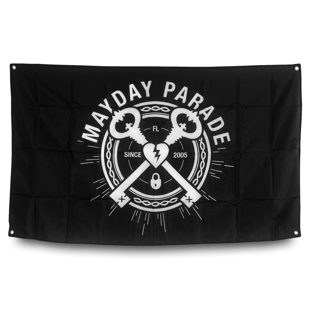 image of a black wall flag on a white background. the flag is a rectangle with white print covering it with arched text on top that says mayday parade with two keys crossed over each other below. a white broken heart is in the center of the two keys and since 2005 is written on each side