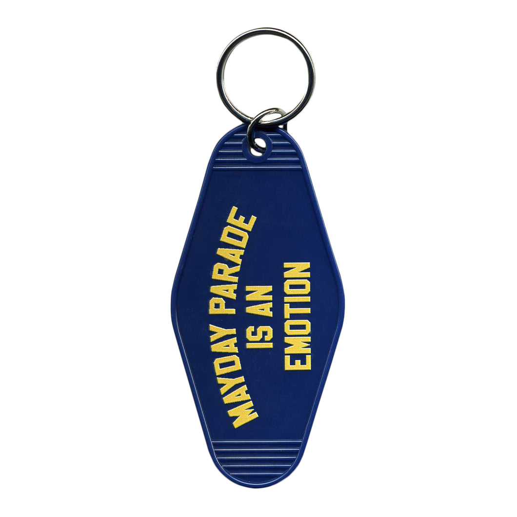 image of a blue, plastic rhombus shaped key ring. in yellow text on top of the keyring says mayday parade is an emotion